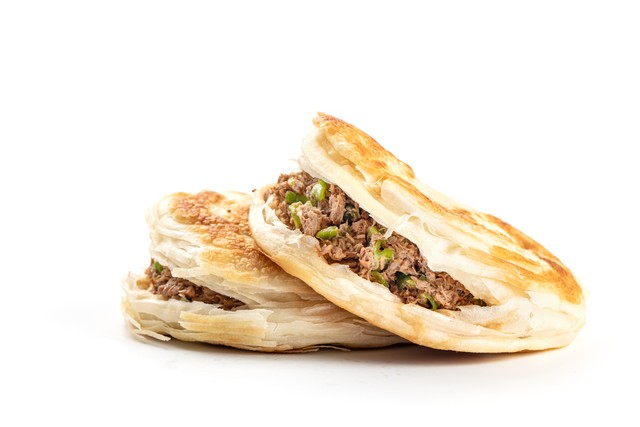 如何形容肉夹馍：从西安街头到世界餐桌，这道美食的魔力究竟有多大？